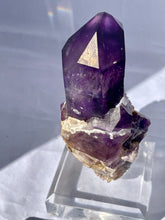 Load image into Gallery viewer, Goboboseb Mountains. Erongo Region, Namibia.  Weight: 180.5 grams  Dimensions: L 5 x W 4 inches x 2.75 inches  Holy smokes this is such an insane piece. Pockets of chalcedony adorn this gorgeous Amethyst point. This baby glows bright green under short wave. Theres pieces that come along once in a lifetime and we consider this to be one of them. Custom stand is included.
